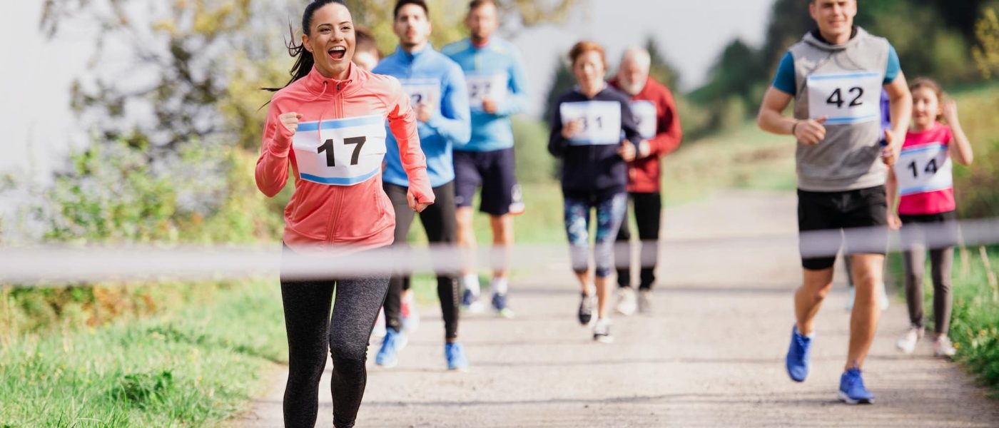 large-group-of-multi-generation-people-running-a-race-competition-in-nature.jpg